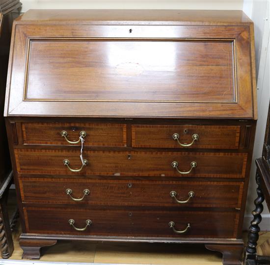 An Edwardian inlaid mahogany bureau W.102cm